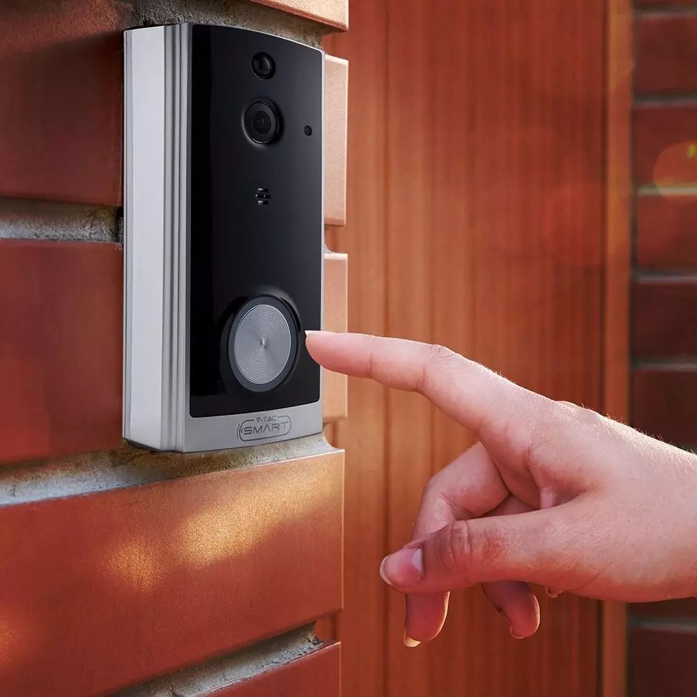 Person ringing a TGH smart video camera doorbell